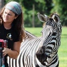 The author, Michelle Martiya, and a zebra