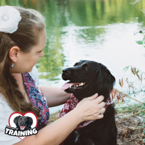 Person and dog looking at each other.